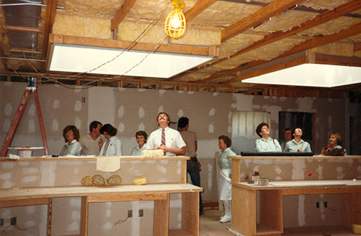 Dentist and his team looking around the new offie in 1984