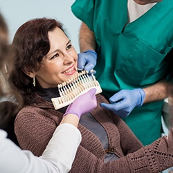 Woman seeking veneers in Toledo