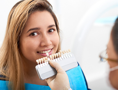 smiling patient having a tooth color match