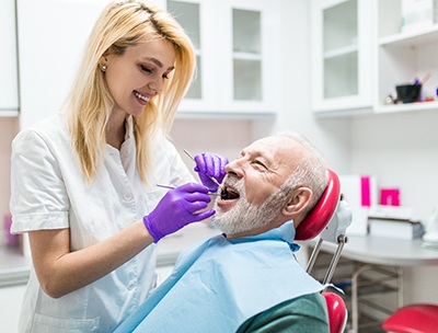 dentist examining a patient’s mouth