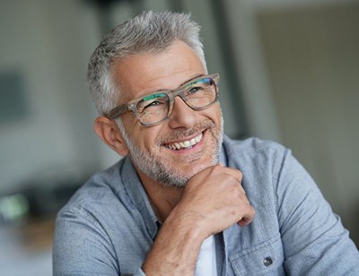 older man smiling with dentures in Toledo 