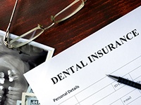 Dental insurance paperwork for the cost of dentures in Toledo