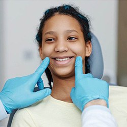 Dentist checking patient's smile