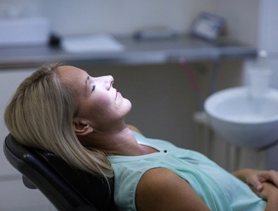 Woman relaxing with IV dental sedation in Toledo