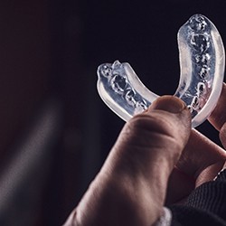 Closeup of patient holding mouthguard