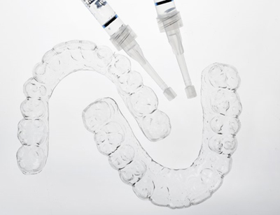 take-home teeth whitening trays and bleaching gel 
