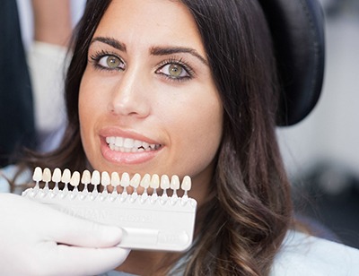 woman smiling with porcelain veneers in Toledo