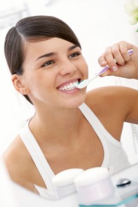 Young woman brushing her teeth