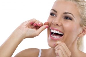 Your dentist in Toledo recommends flossing.