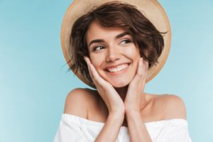 Smiling woman with summer hat