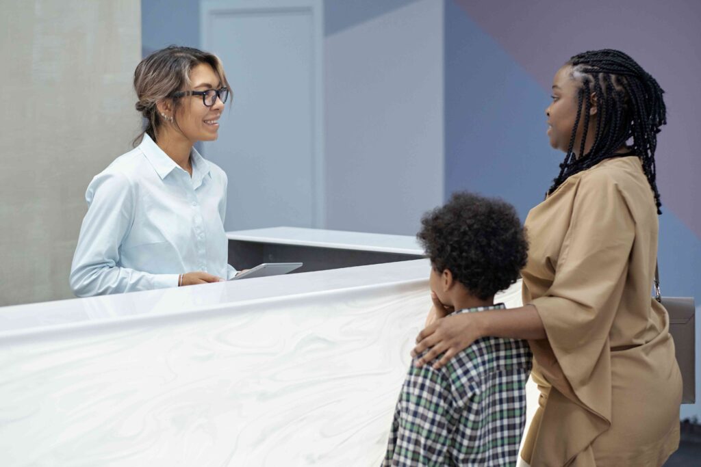 Woman talking to a receptionist